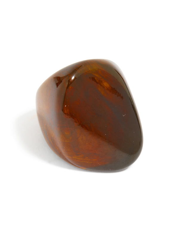 Crafted from dark brown acrylic, this large obtuse ring with chunky statement design front view