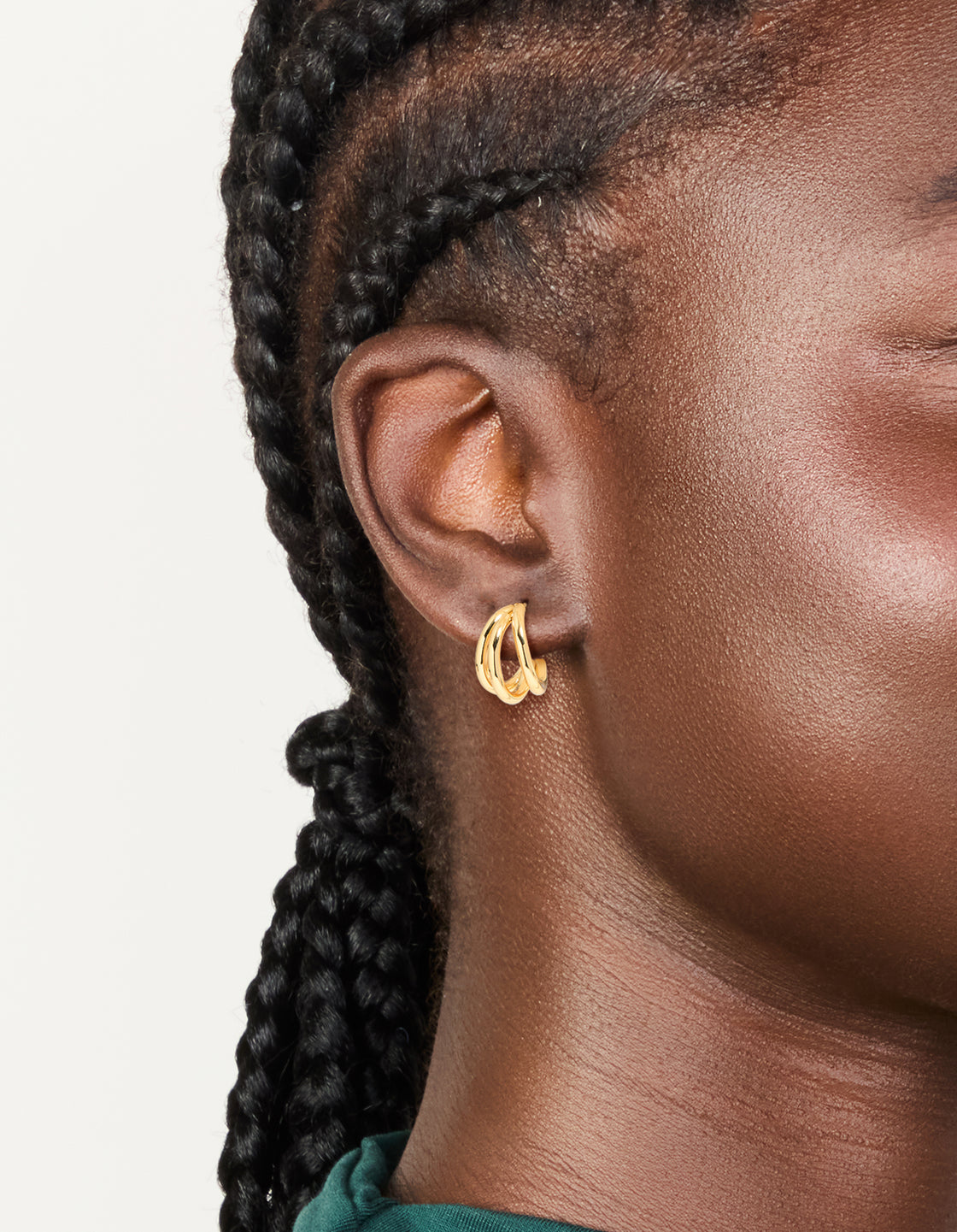 Featuring waterproof gold plated stainless steel double row hoop earrings on ear view