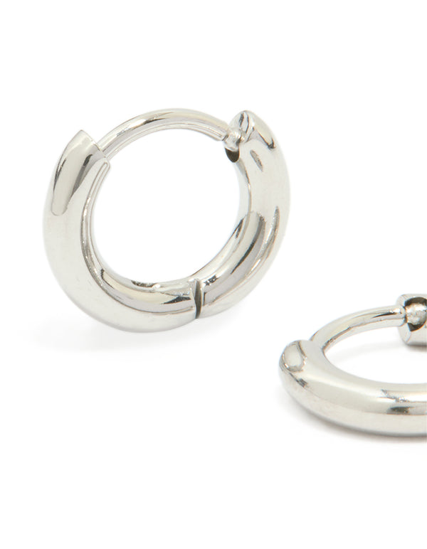 Featuring waterproof stainless steel clicker hoop earrings in silver close up view