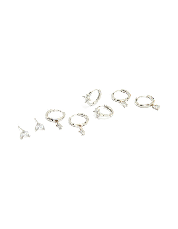 Showcasing waterproof stainless steel cubic zirconia and baguette flower huggie earrings in a 4-pack featuring floral design with silver and clear tones front view