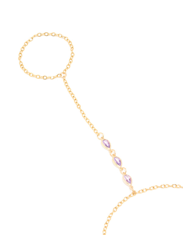 Featuring a waterproof gold plated stainless steel cubic zirconia hand chain bracelet close up view