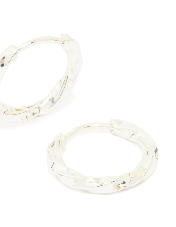 Highlighting waterproof stainless steel twisted hoop earrings in silver post detail view