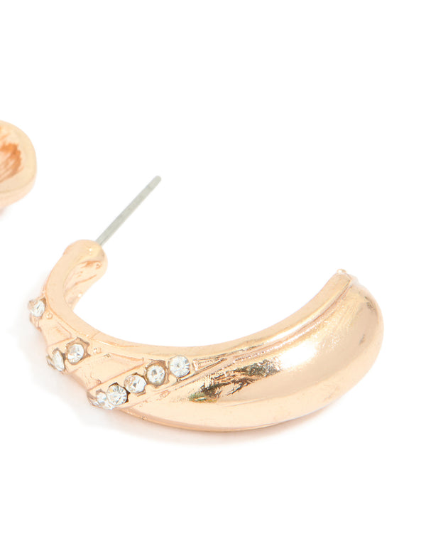 Detailed view of gold diamante pear open hoop earrings showcasing white crystal settings and post detail view