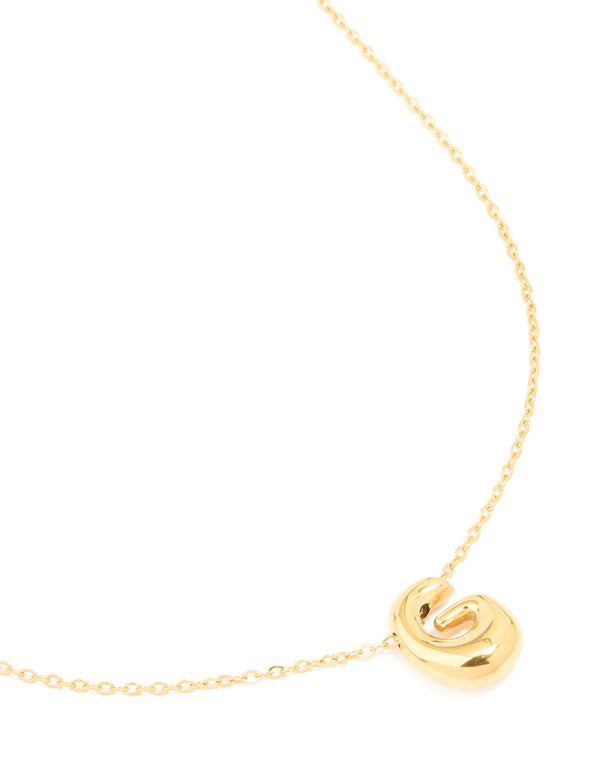 Showcasing waterproof gold plated stainless steel large bubble letter G necklace featuring a bold initial pendant close up view