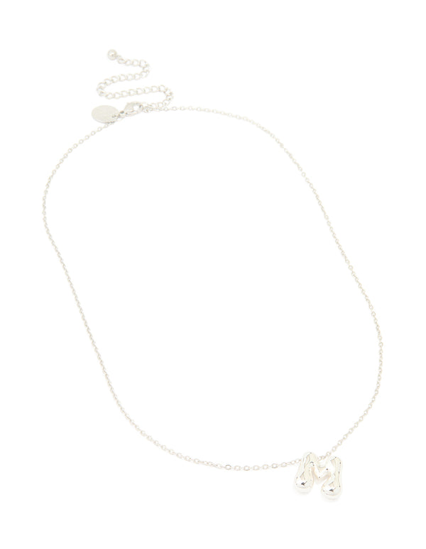Featuring a waterproof stainless steel dainty initial pendant with large bubble letter M necklace in silver front view