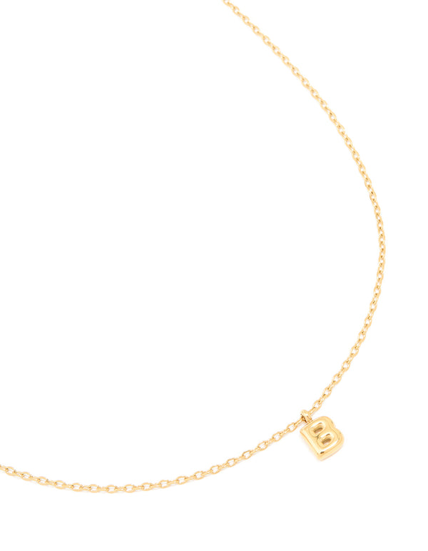 Featuring a waterproof mini bubble letter B initial pendant necklace crafted from gold plated stainless steel close up view