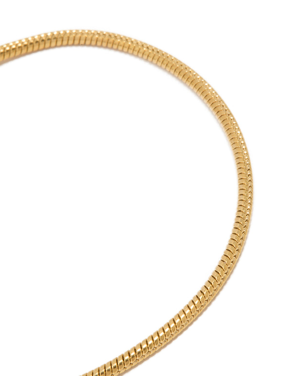 Highlighting waterproof snake chain bracelet with gold plated stainless steel and dainty design close up view