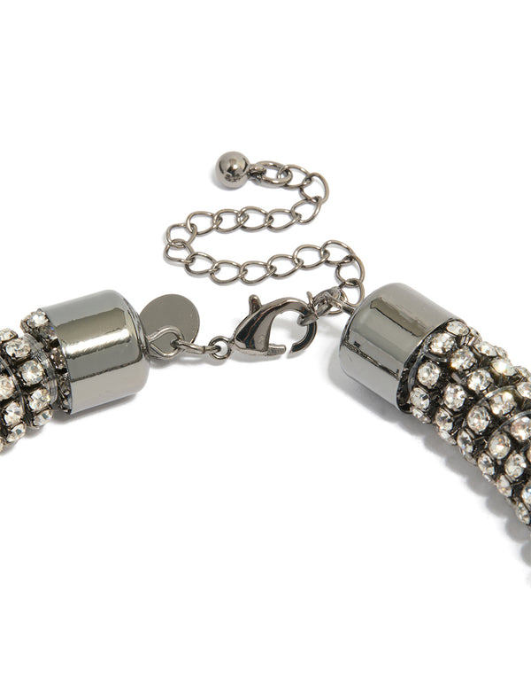 Highlighting a gunmetal diamante tube necklace in silver with statement styling clasp detail view