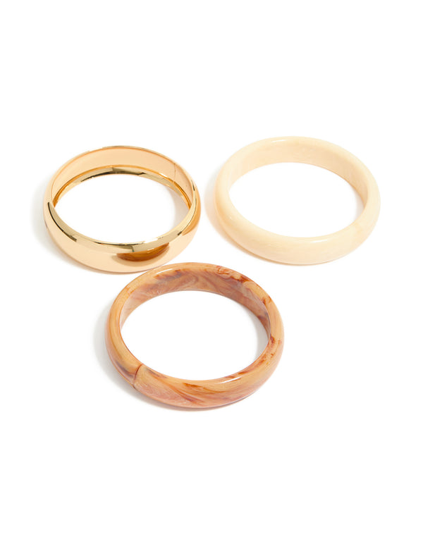 Featuring gold and neutral acrylic bangles in a 3-pack bracelet set front view