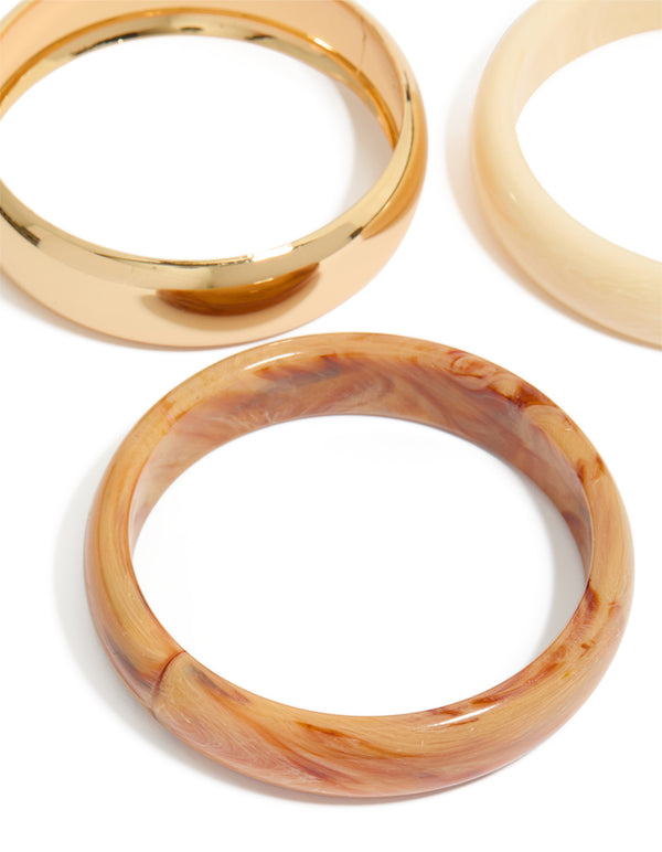 Crafted from gold and neutral acrylic 3-pack bangles bracelet close up view