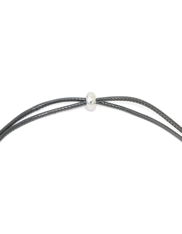 Highlighting the waterproof initial feature necklace with a large bubble letter A pendant in stainless steel on grey cord clasp detail view