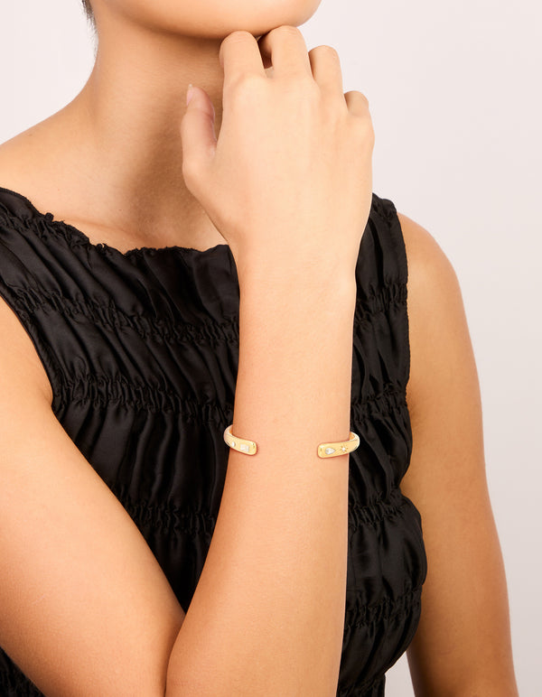 Showcasing a waterproof celestial diamante stainless steel wrist cuff in dainty design on wrist view