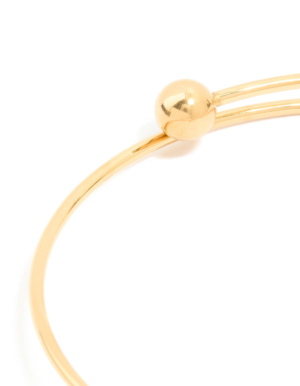 Designed with a waterproof ball end bangle crafted from gold plated stainless steel closure detail view