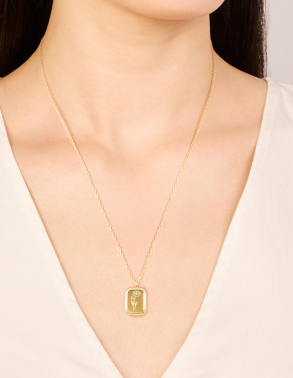 Showcasing a waterproof gold plated stainless steel floral pendant necklace on neck view