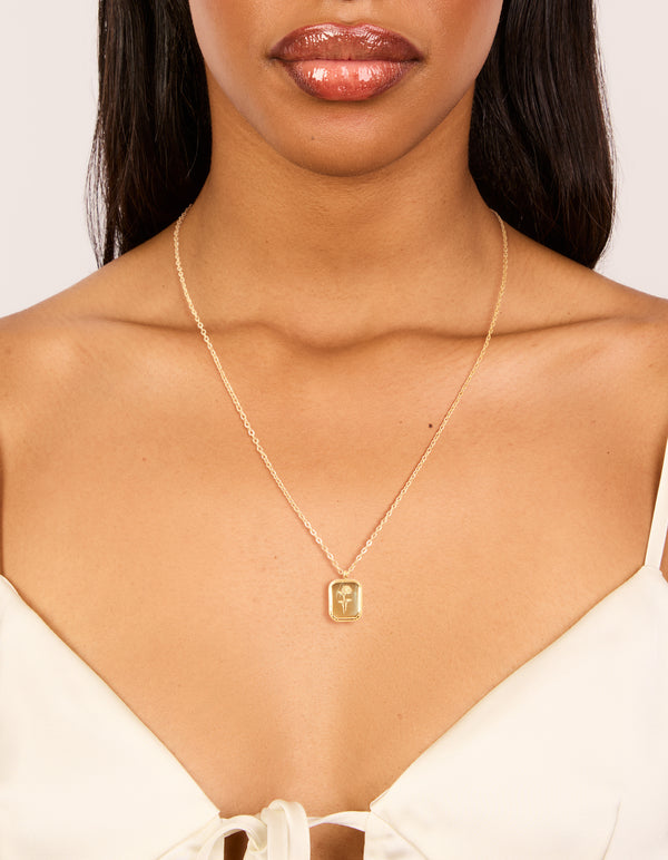 Showcasing a waterproof birth flower July larkspur necklace crafted from gold plated stainless steel with floral detail on neck view