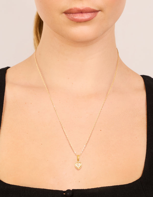 Showcasing waterproof gold plated stainless steel diamante mini pavé heart pendant on model view