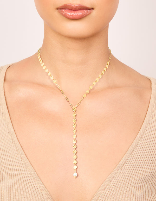 This waterproof Y-necklace in gold plated stainless steel features disc on neck view