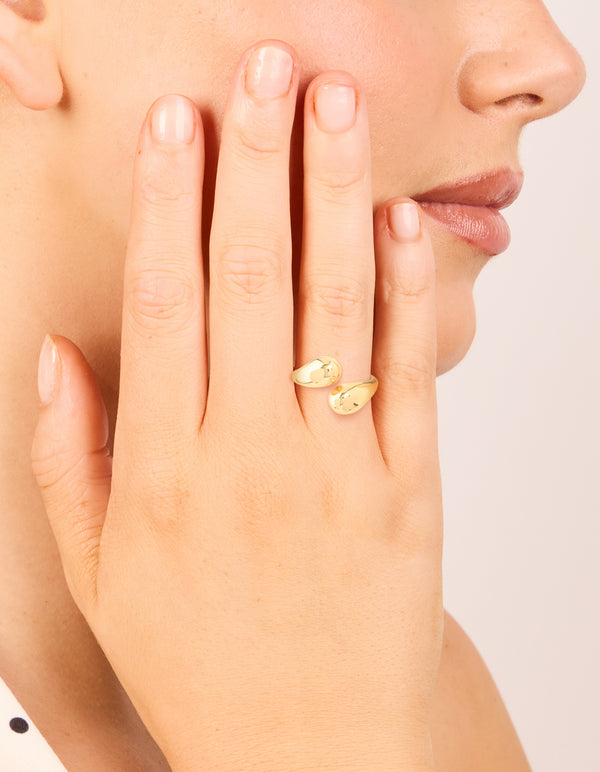 Featuring a waterproof gold plated stainless steel double teardrop wrap around ring on finger view