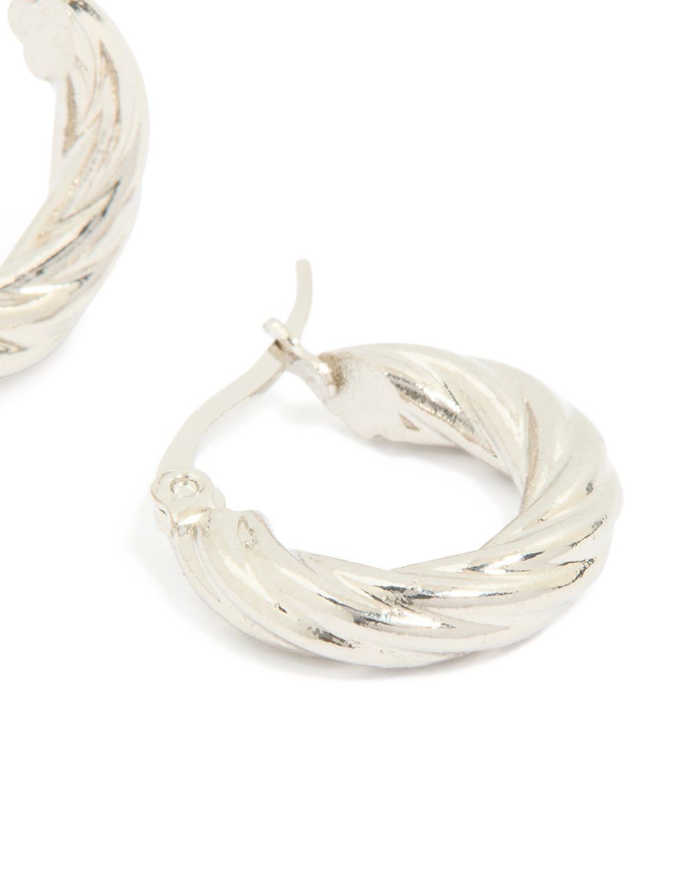 Highlighting waterproof stainless steel twisted hoop earrings in silver close up view