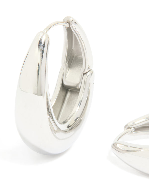 Designed with waterproof stainless steel, these oval hinged hoop earrings in silver feature close up view