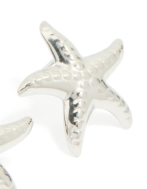 Featuring waterproof stainless steel textured starfish stud earrings with ocean in silver close up view