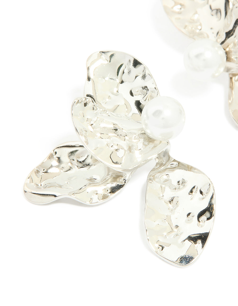Featuring floral design with pearl details, these waterproof stainless steel large stud earrings in silver and white close up view