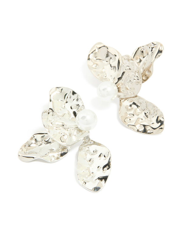 Showcasing large floral stud earrings crafted from waterproof stainless steel featuring pearl accents in silver and white front view