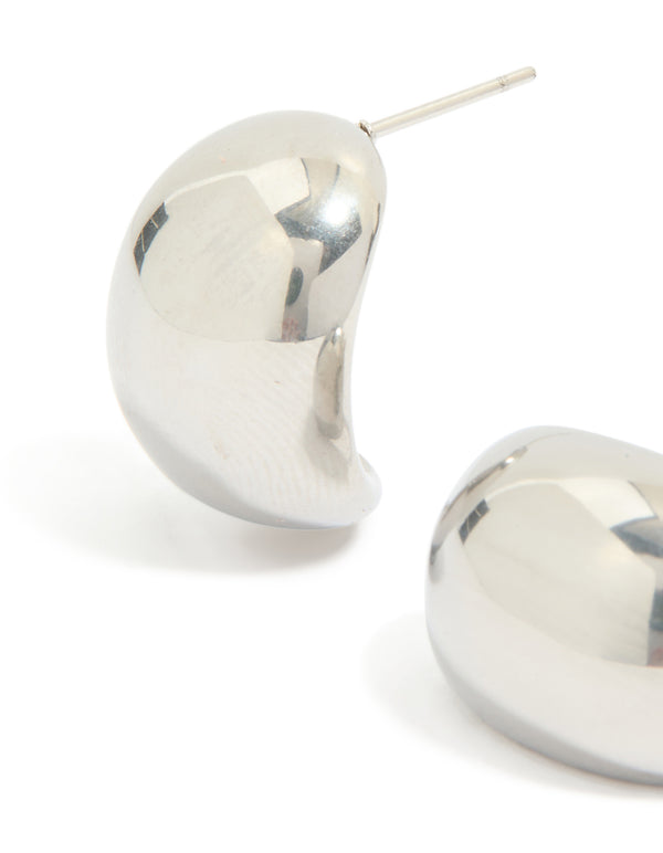 Showcasing waterproof stainless steel small cave stud earrings in silver close up view