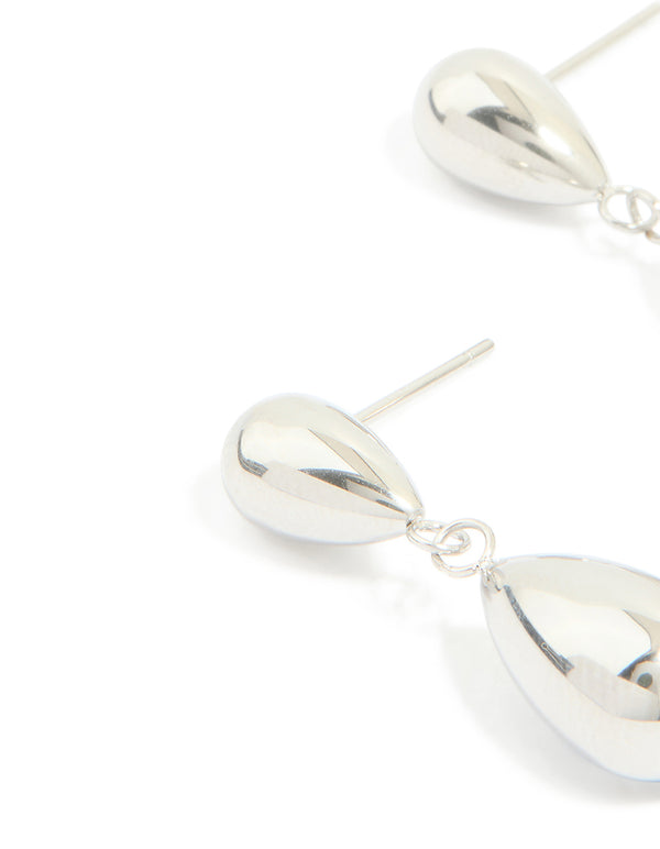 Designed with waterproof stainless steel pear double drop earrings in silver close up view