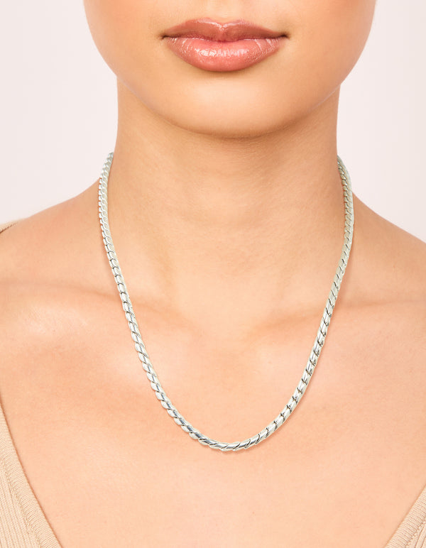 Showcasing a waterproof stainless steel thick twist chain in silver, chunky style on neck view