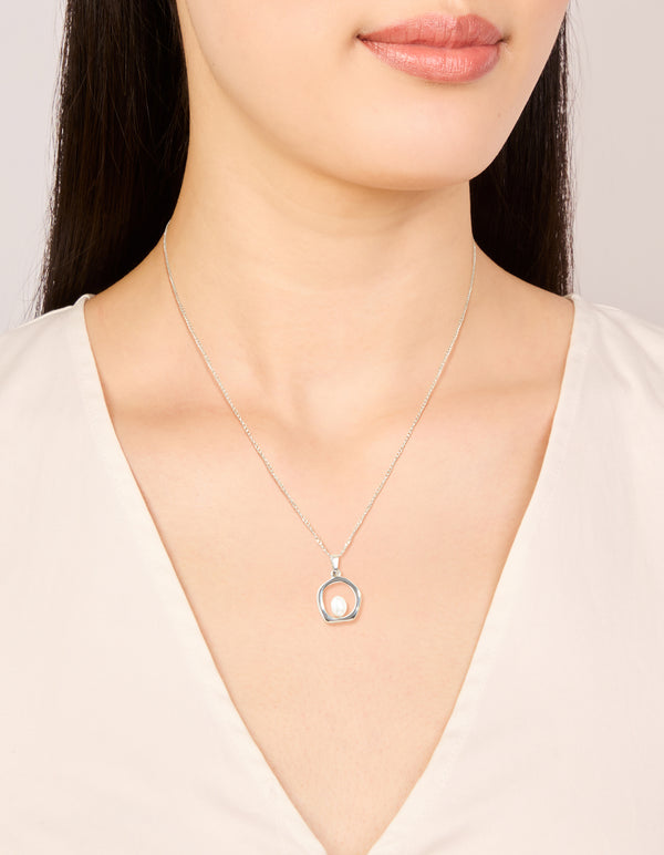 Crafted from stainless steel this waterproof freshwater pearl molten hoop pendant necklace sits elegantly in silver and white on neck view