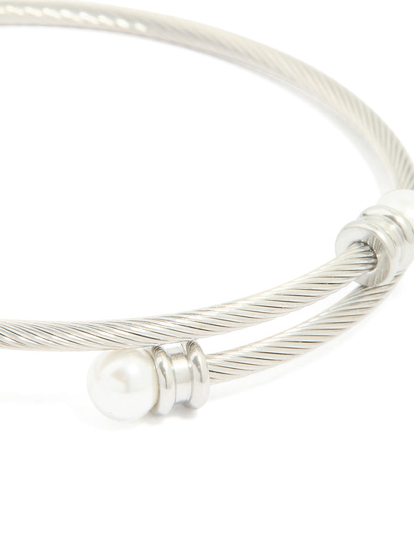 This waterproof stainless steel pearl twisted bangle in silver and white close up view