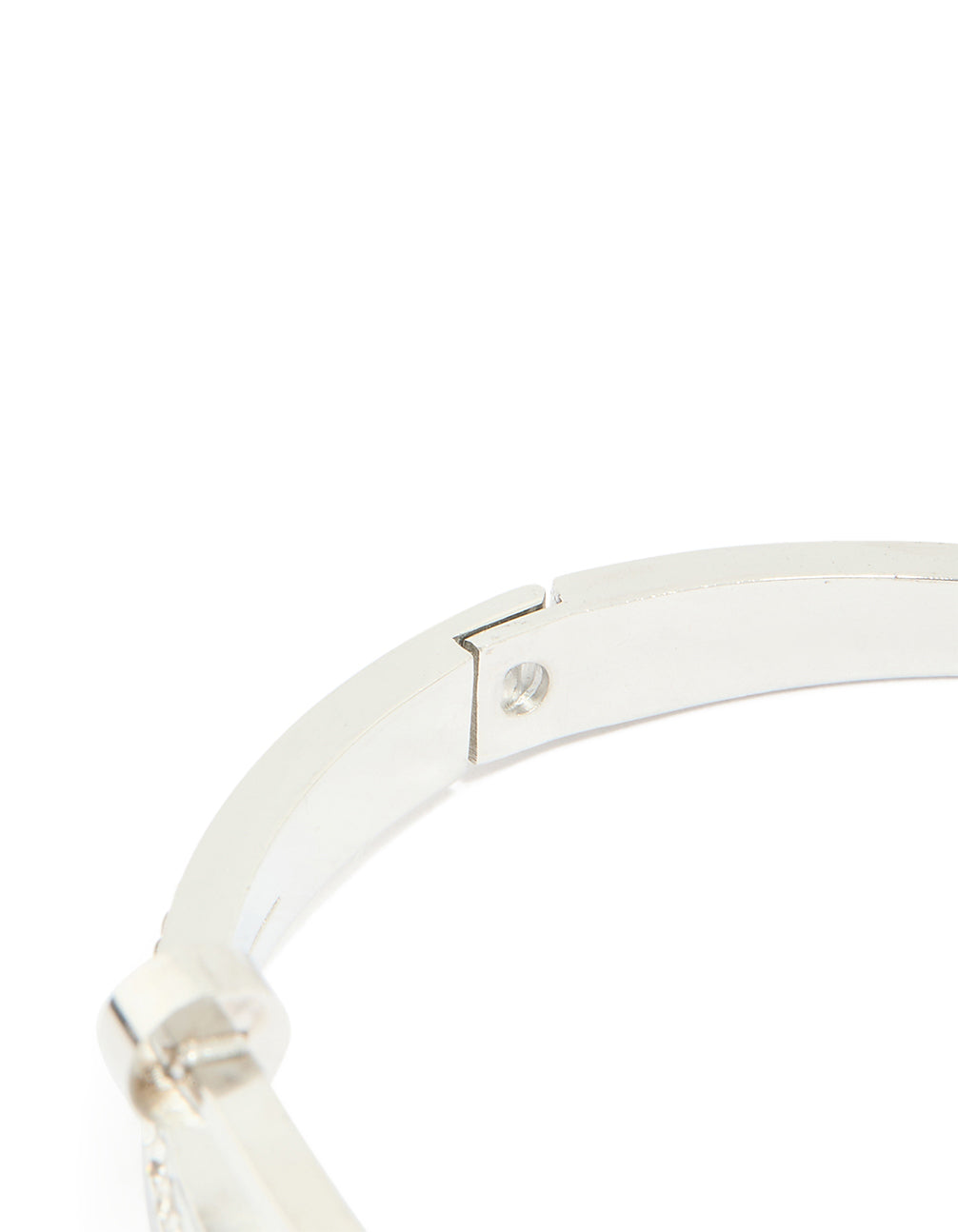 Crafted from waterproof stainless steel with cubic zirconia nail hinge bangle in silver with clear stones and statement bangle closure detail view