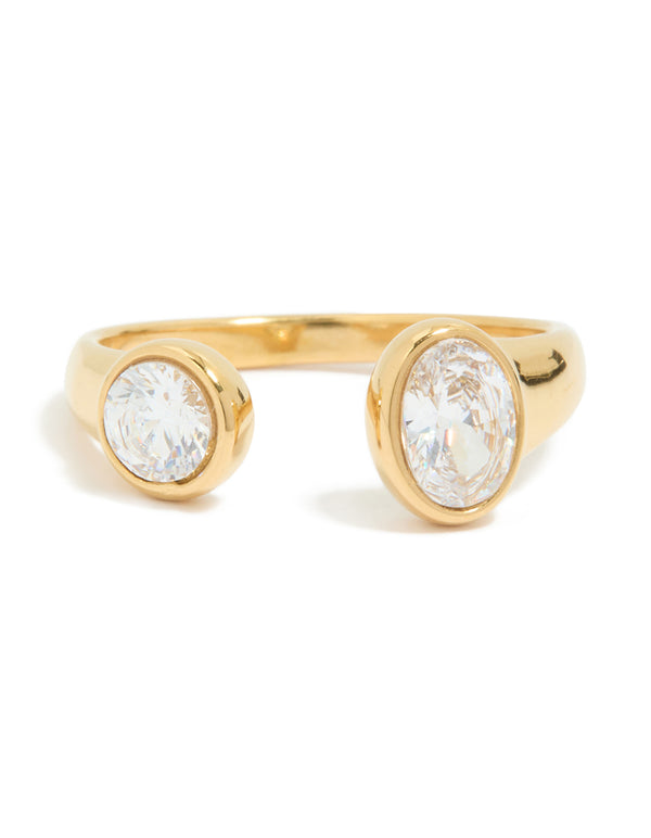 A waterproof gold plated stainless steel open ring highlighting oval and round cubic zirconia detail in close up view