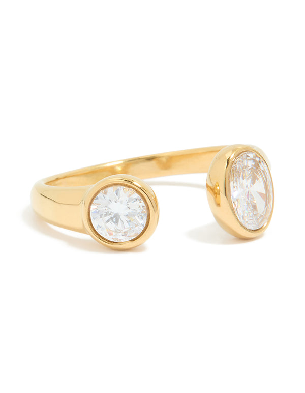 Showcasing a waterproof gold plated stainless steel open ring with oval and round cubic zirconia in front view