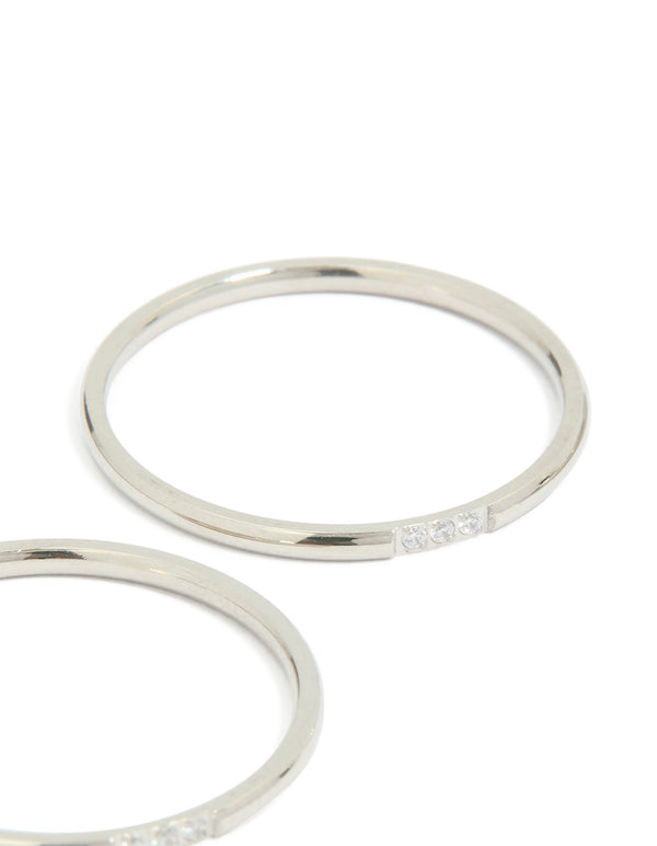 Showcasing waterproof stainless steel thin cubic zirconia trio rings in a 3-pack with silver and clear stone accents close up view