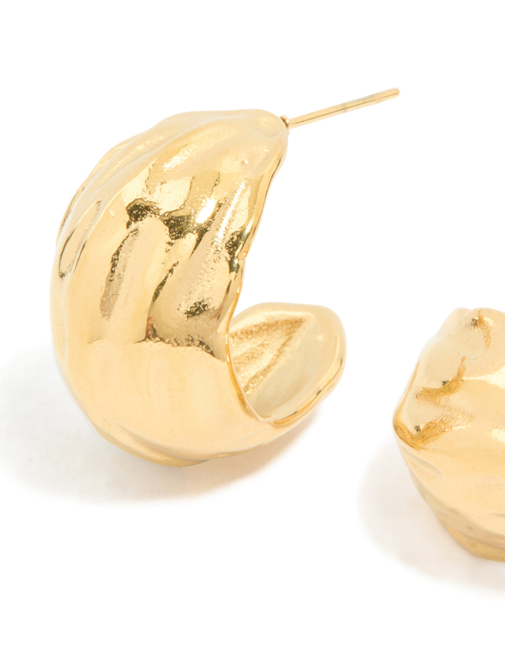 These waterproof gold plated stainless steel chunky curved hoop earrings reveal textured surface close up view