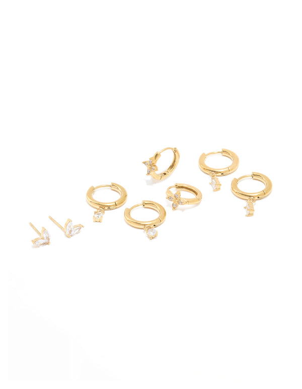 Showcasing a waterproof gold plated stainless steel cubic zirconia huggie and stud earrings set featuring butterfly charm with baguette stone cut front view