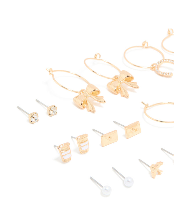 Discover this assorted 12-pack showcasing bow, butterfly, charm, and pearl accents in gold with white and ivory tones close up view