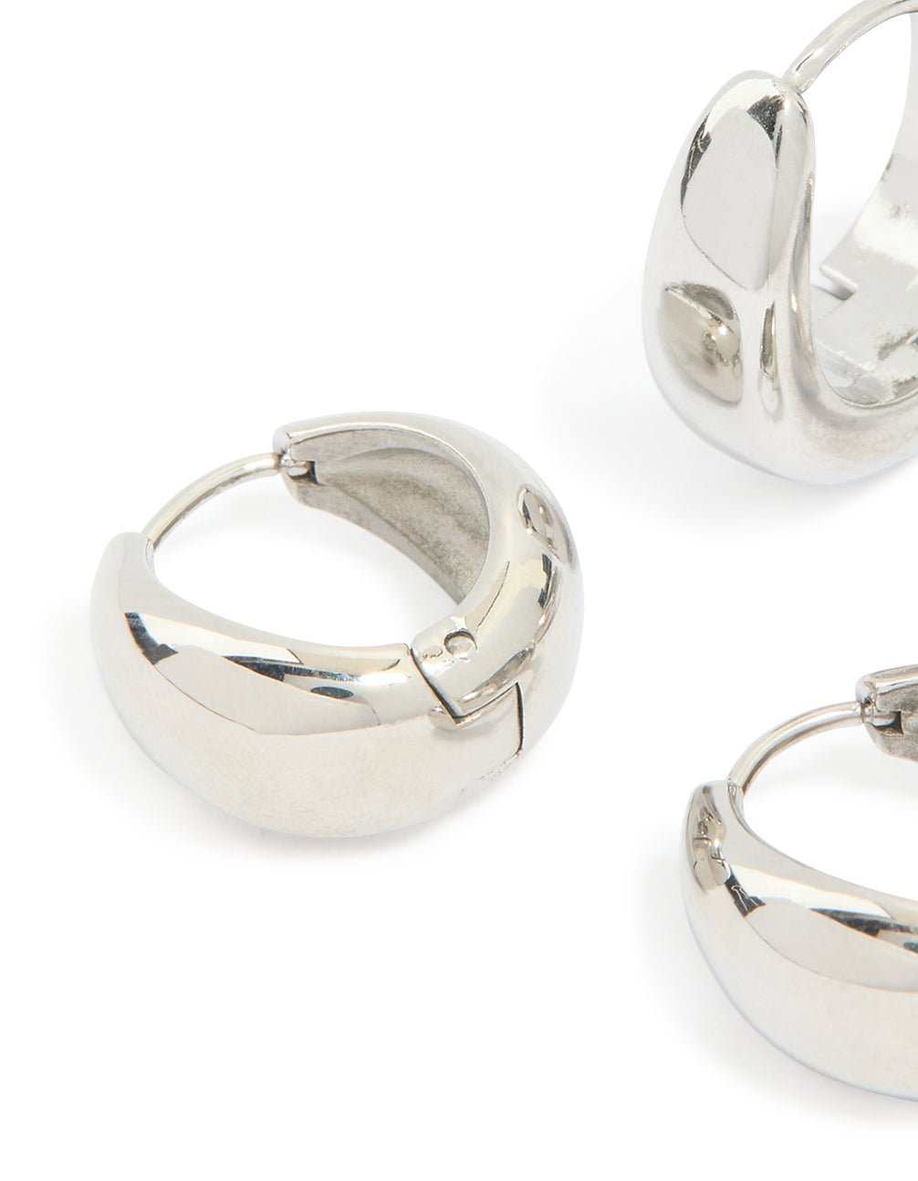 Featuring waterproof stainless steel chunky earrings in a 2 pack in silver with huggie closure close up view