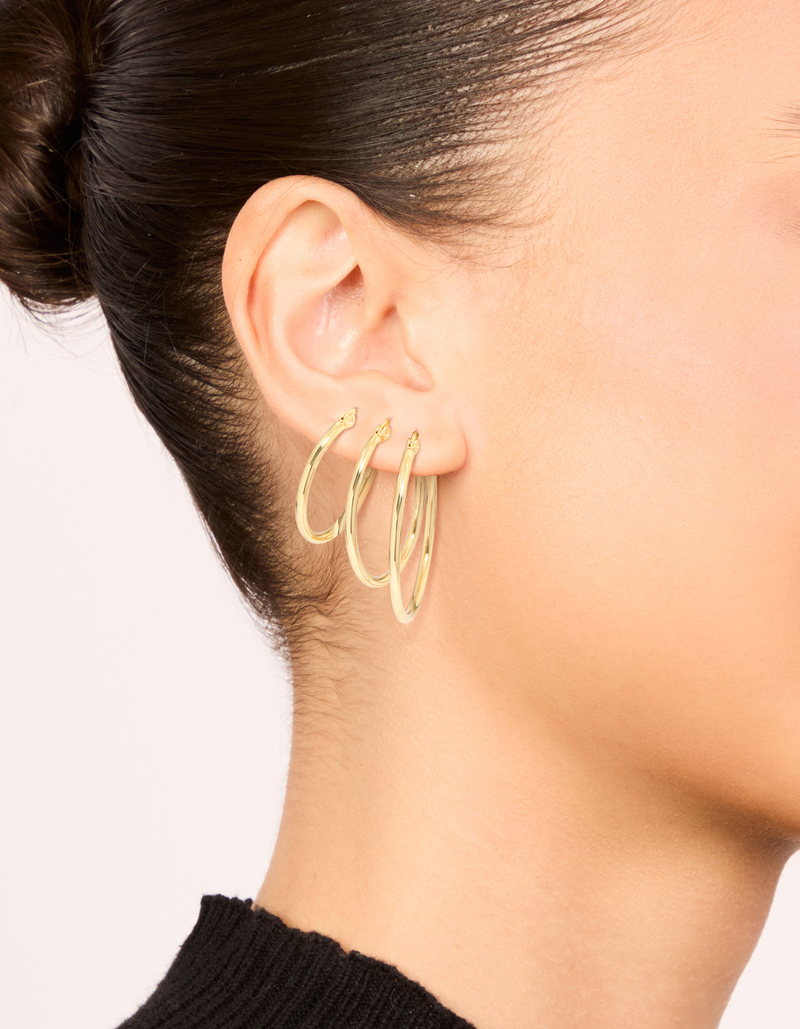 Waterproof gold plated stainless steel large thin mix hoop earrings 3-pack on ear view