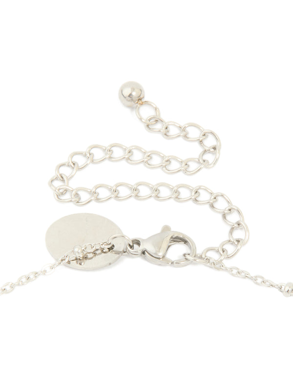 Featuring waterproof stainless steel necklace with mary charm, cross and balls in silver statement styling clasp detail view