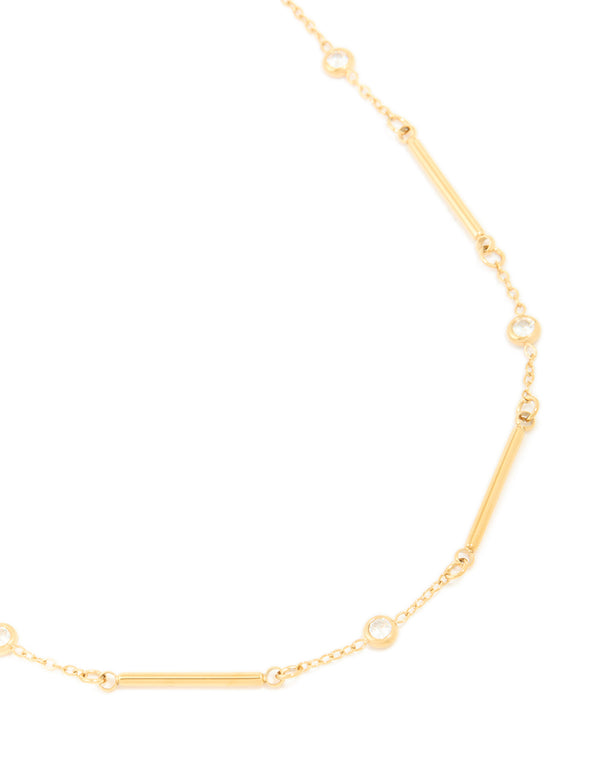 Showcasing a waterproof pebble station necklace crafted from gold plated stainless steel close up view