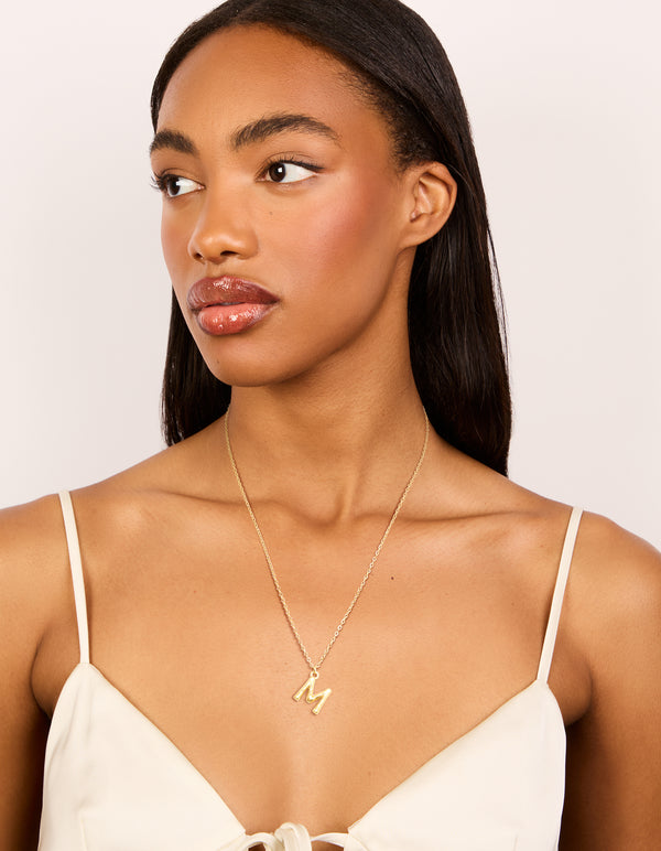 Designed with waterproof gold plated stainless steel, this bamboo letter M dainty style necklace showcases initials pendant model view