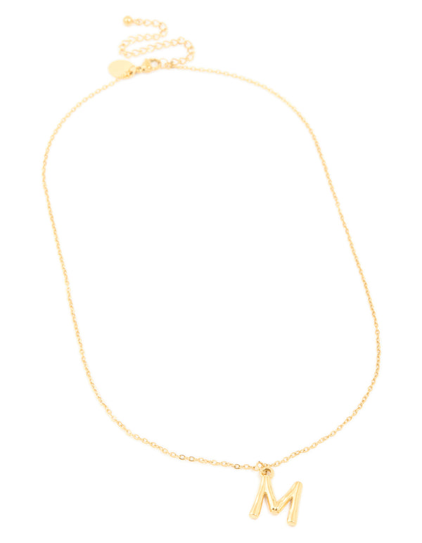 Featuring a waterproof gold plated stainless steel bamboo letter M dainty style necklace with initials pendant front view