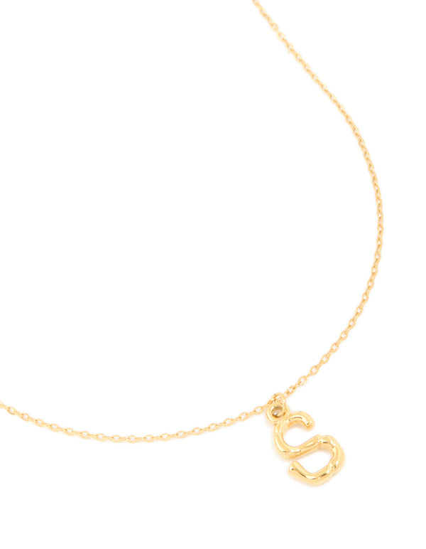 Showcasing a waterproof initial necklace crafted from stainless steel with bamboo letter S in gold plated finish close up view
