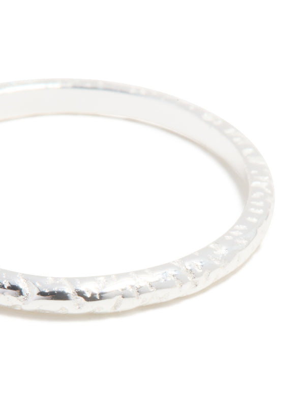 Highlighting sterling silver molten ring in close up view