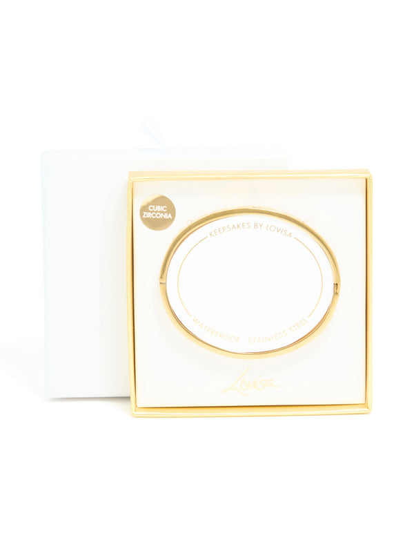 Displaying a waterproof gold plated stainless steel evil eye bangle with cubic zirconia in statement style closure detail view