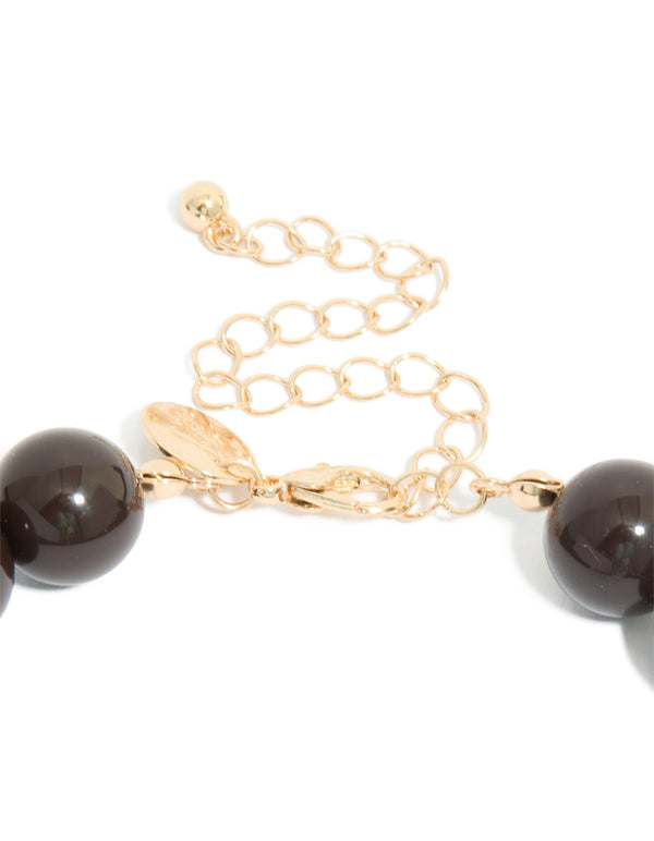 Chocolate brown acrylic beaded necklace and gold clasp detail view