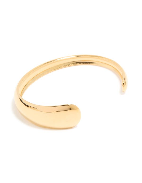 Discover a waterproof gold plated stainless steel asymmetrical wrist cuff featuring chunky design front view